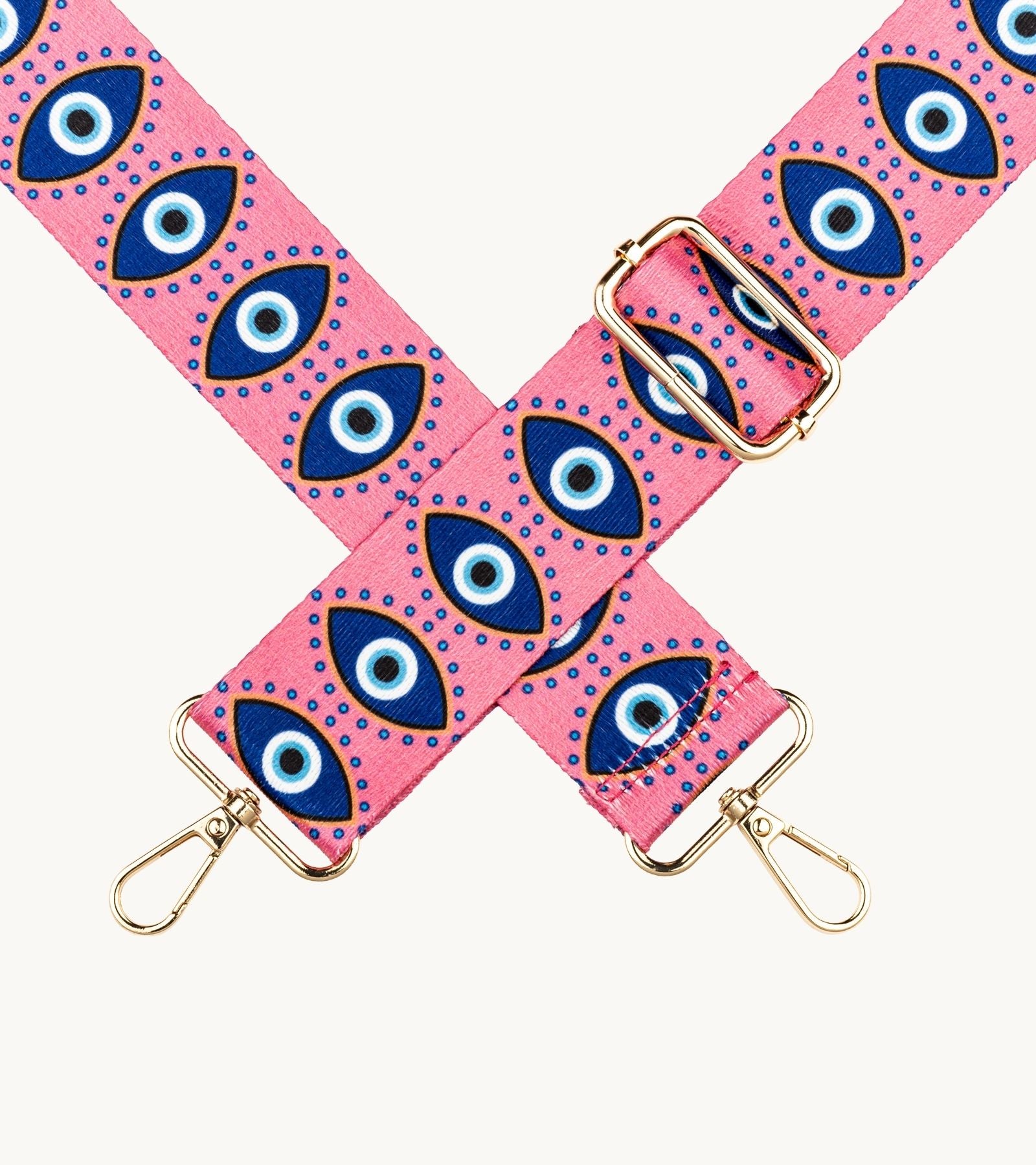 Detail crossbody popruhu na mobil Strappy Art Evil Eye s motívom oka v ružovo-modrej farebnej kombinácii.